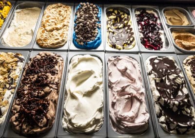 Sweet Ice Cream Assortment at Angelo's Restaurant Ice cream variety with chocolate, vanilla, and berry flavors at Angelo's Restaurant.
