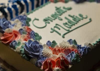 Celebrating at Angelo's Restaurant Decorated cake with "Congratulations" message for a special celebration.