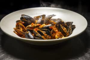 Delicious seafood marinara pasta with mussels and tomato sauce.