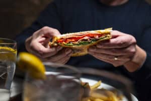 Freshly made sandwich with meats, cheese, and vegetables at Angelo's Restaurant.