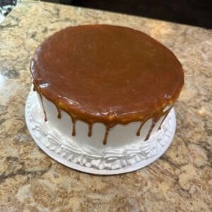 Delicious caramel cake with smooth frosting and rich caramel topping, perfect for celebrations.