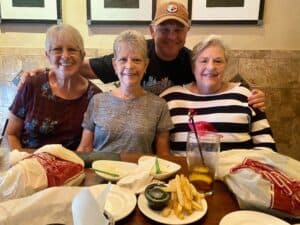 Family enjoying a meal together at Angelo's Restaurant, showcasing a warm and inviting atmosphere.