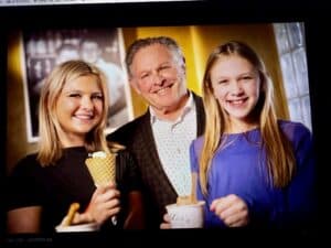 Happy family enjoying ice cream at Angelo's Restaurant, smiling and having fun.